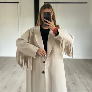 Manteau à franges
